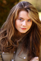 Fototapeta premium Beautiful young woman. Outdoor portrait