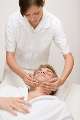 Obraz na płótnie Canvas Male cosmetics - facial massage in salon