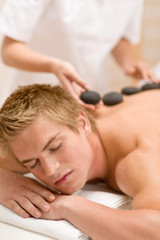 Fototapeta na wymiar Lastone therapy - man at luxury massage
