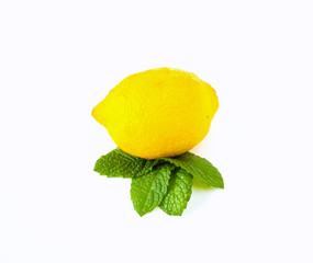 lemon and leaves of peppermint on white