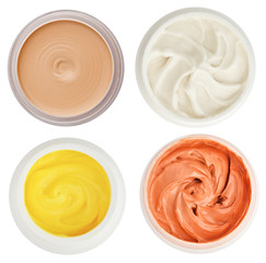 Set of 4 different dermal creams and gels isolated on white