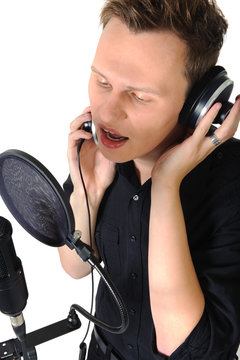 young man with microphone on white background