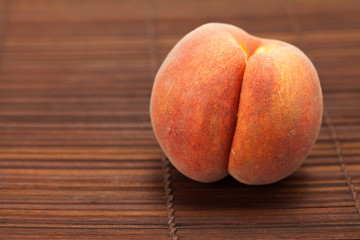 Peach on a bamboo mat