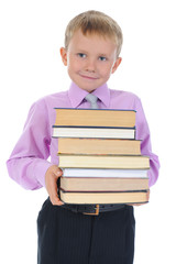 boy holds a stack of books