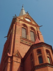 Fototapeta na wymiar Church tower from red bricks
