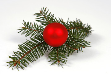 Christmas decoration with the twigs of the spruce and bauble