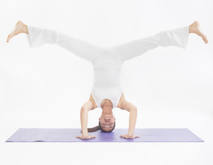 Naklejka premium professional yoga trainer in studio