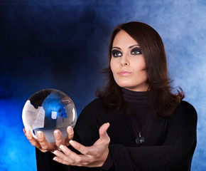Young woman with crystal ball.