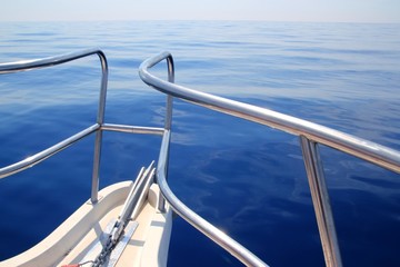 Fototapeta na wymiar boat sailing blue calm ocean sea bow railing