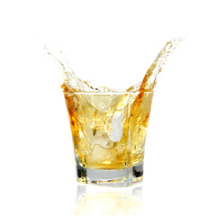 GLass of whiskey splashing out