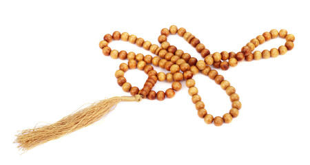 Wooden rosary over white background