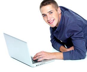 man with laptop on floor