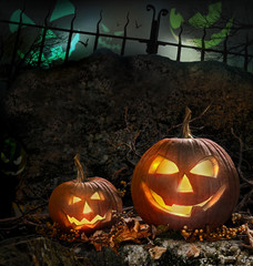 Halloween pumpkins on rocks  at night
