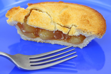 Apple pie with fork on plate