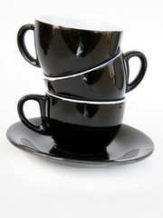 Three black cups isolated on white background