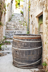 Cedar barrel in a narrow street