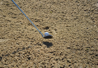 taking a shot out of the bunker