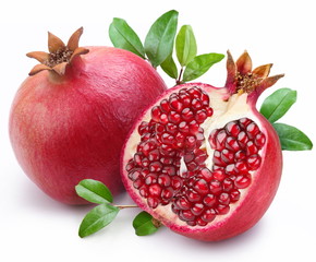 Juicy pomegranate and its half with leaves. - Powered by Adobe