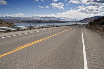 transport road through a countryside mountain range snow