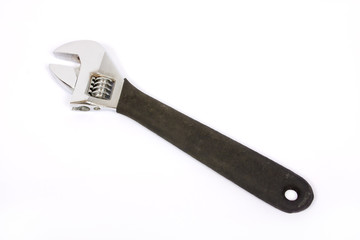 Wrench over white background