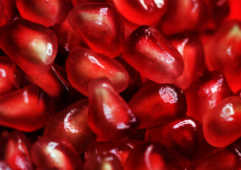 Pomegranate background. Macro of peeled ripe seeds
