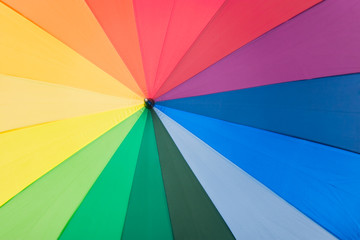 Umbrella with rainbow colors as background