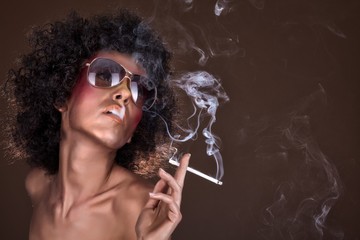 girl with afro hair and a cigarette