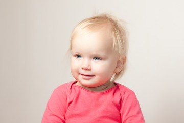 Naklejka premium Portrait of cute young baby sit on chair and grimacing