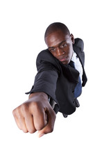 African businessman with his fist up (isolated on white)