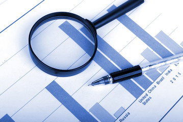 Magnifier,pen and trend graph