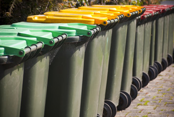Wheelie bins for garbage collection and recycling in a row