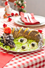 Stuffed pike diced into pieces on New year table