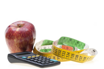Apple, tape and calculator