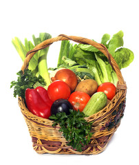 basket with vegetables isolated on white