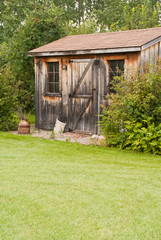 A charming, rustic garden shed made from reclaimed timber