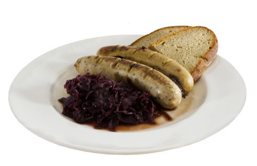 bratwurst with red cabbage and slices of rye bread