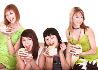 Group of young woman eating cake. Isolated.