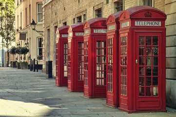 Poster de jardin Londres Traditional old style UK red phone boxes in London.