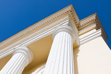 Arch columns under blue sky
