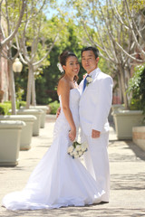 Naklejka premium Happy Bride and Groom on their Wedding Day