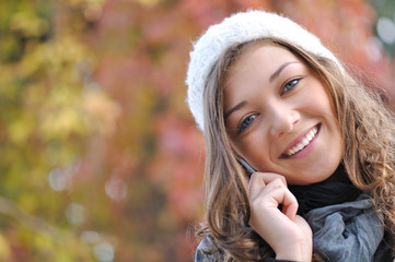 head of happy smiling girl talking on the phone