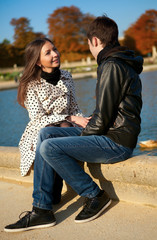 Young beautiful couple in the Luxembourg garden at fall. Paris,