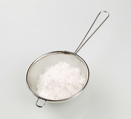 Sieve and powdered sugar