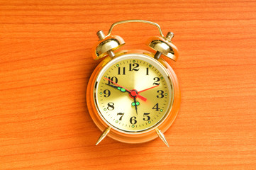 Time concept - alarm clock against the background