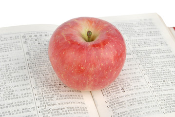 Red apple with dictionary