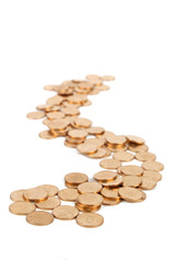 Many of gold coins making curved path