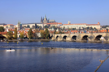 View on the autumn Prague gothic Castle with the Charles Bridge