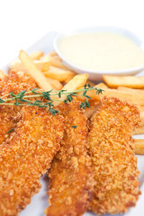 Chicken nuggets with french fries and yogurt sauce
