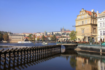 View on the autumn Prague gothic Castle with the Charles Bridge