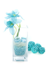 a decorative vase with a blue silk flower
